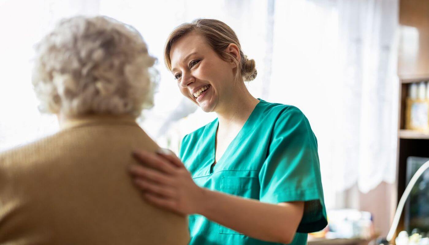 Care worker with elderly patient